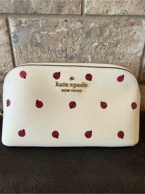 kate spade cream cosmetic pouch with red ladybug print